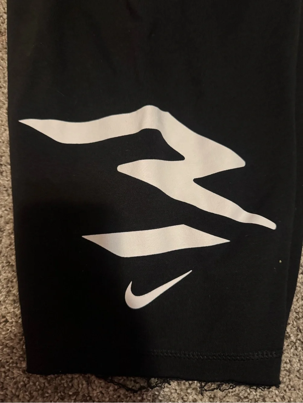 Nike Black Shorts with White Graphic Swoosh